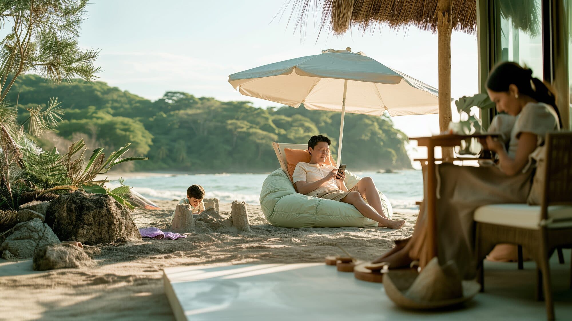 Relaxing in the shade at the beach while a child builds a sandcastle